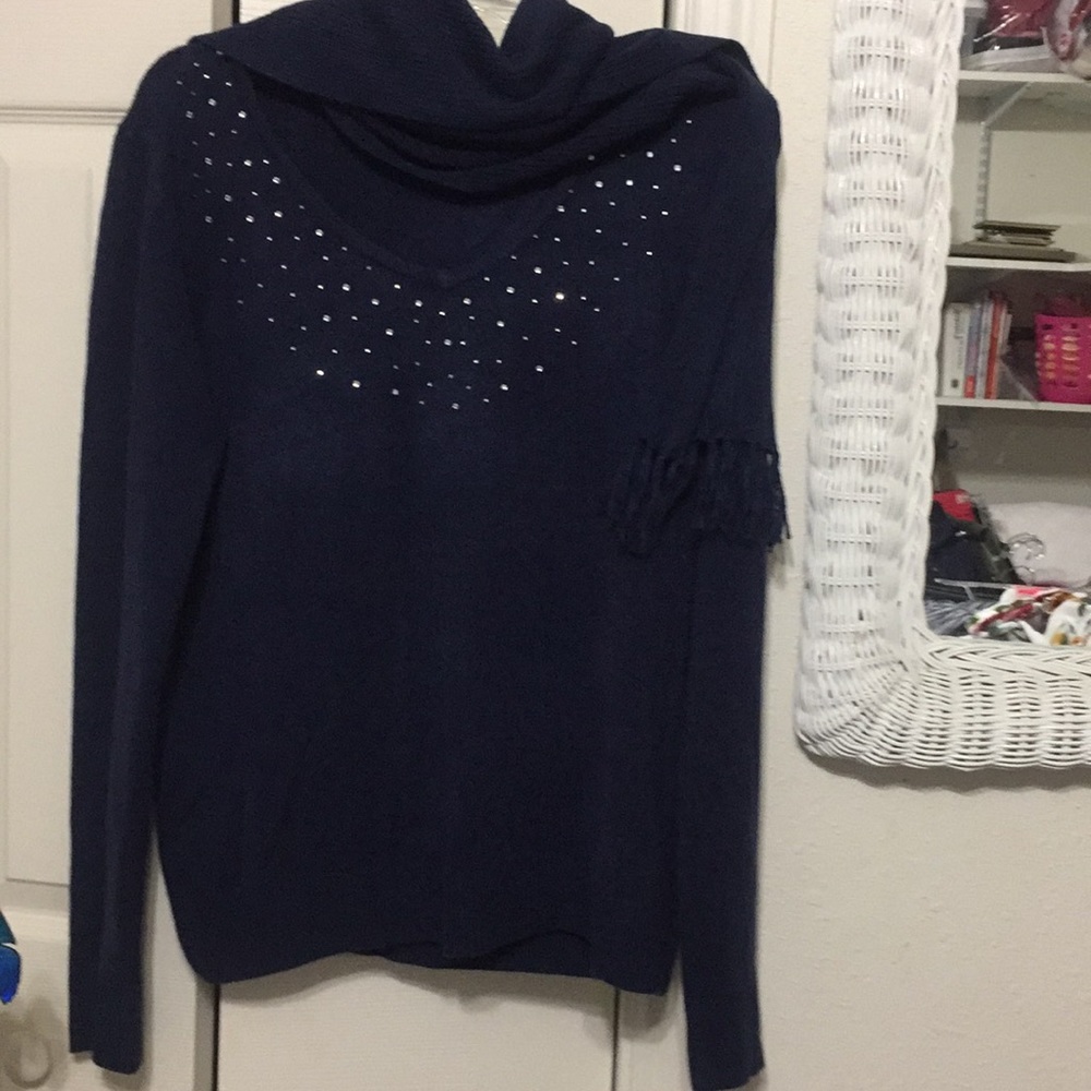 Navy Blue sweater, rhinestones, and a scarf.